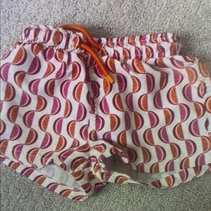 Vibrant Kids Swim Trunks with Orange and Pink Waves